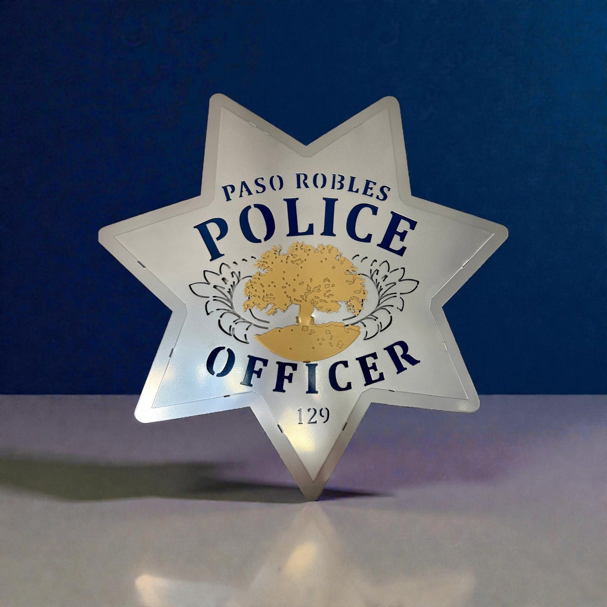 Front view of silver star and blue lettering, Paso Robles Police Badge by IRONiNK.