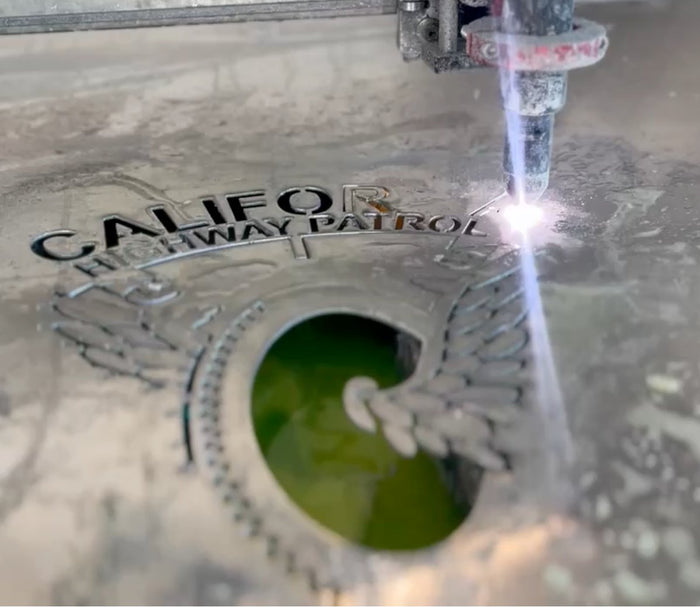 Custom metal badge sign during machine cutting, Add-a-Badge by IRONiNK.