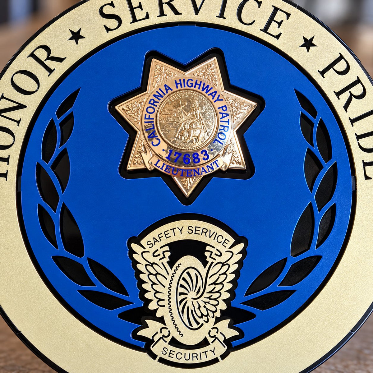 Badge Display CHP (No Bottom Rocker): close-up of badge and gold wing and wheel.