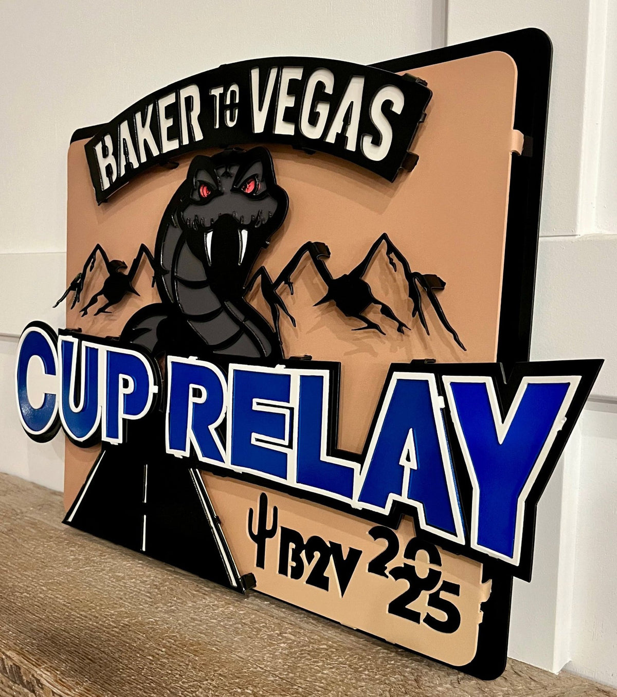 Angled view showing raised runner and lettering, Baker to Vegas Challenge Cup Relay Sign by IRONiNK.