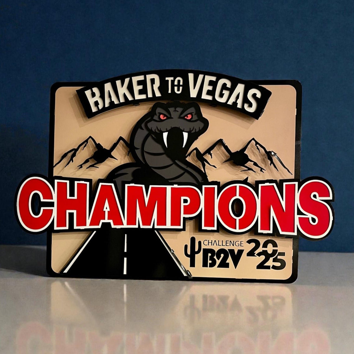 Champions sign with red lettering against a dark background, Baker to Vegas Champions Sign by IRONiNK.
