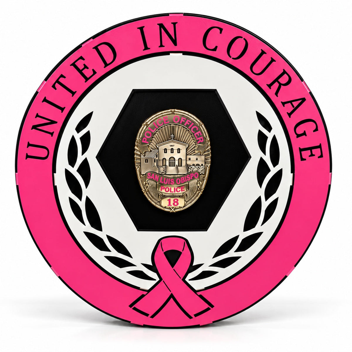 Front view of the round pink and white Breast Cancer Awareness badge display reading United in Courage with a San Luis Obispo Police badge