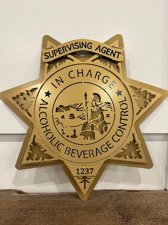 Close-up of agent in charge lettering, California ABC Investigations by IRONiNK.