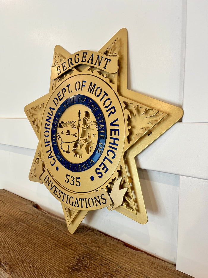 Angled view showing raised gold layers, California DMV Investigations by IRONiNK.