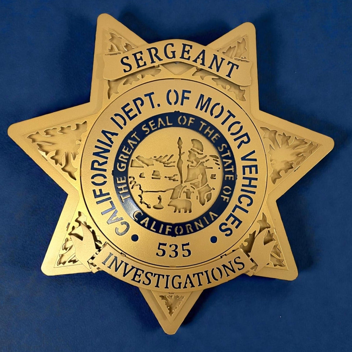 Front view of California seal and blue lettering, California DMV Investigations by IRONiNK.