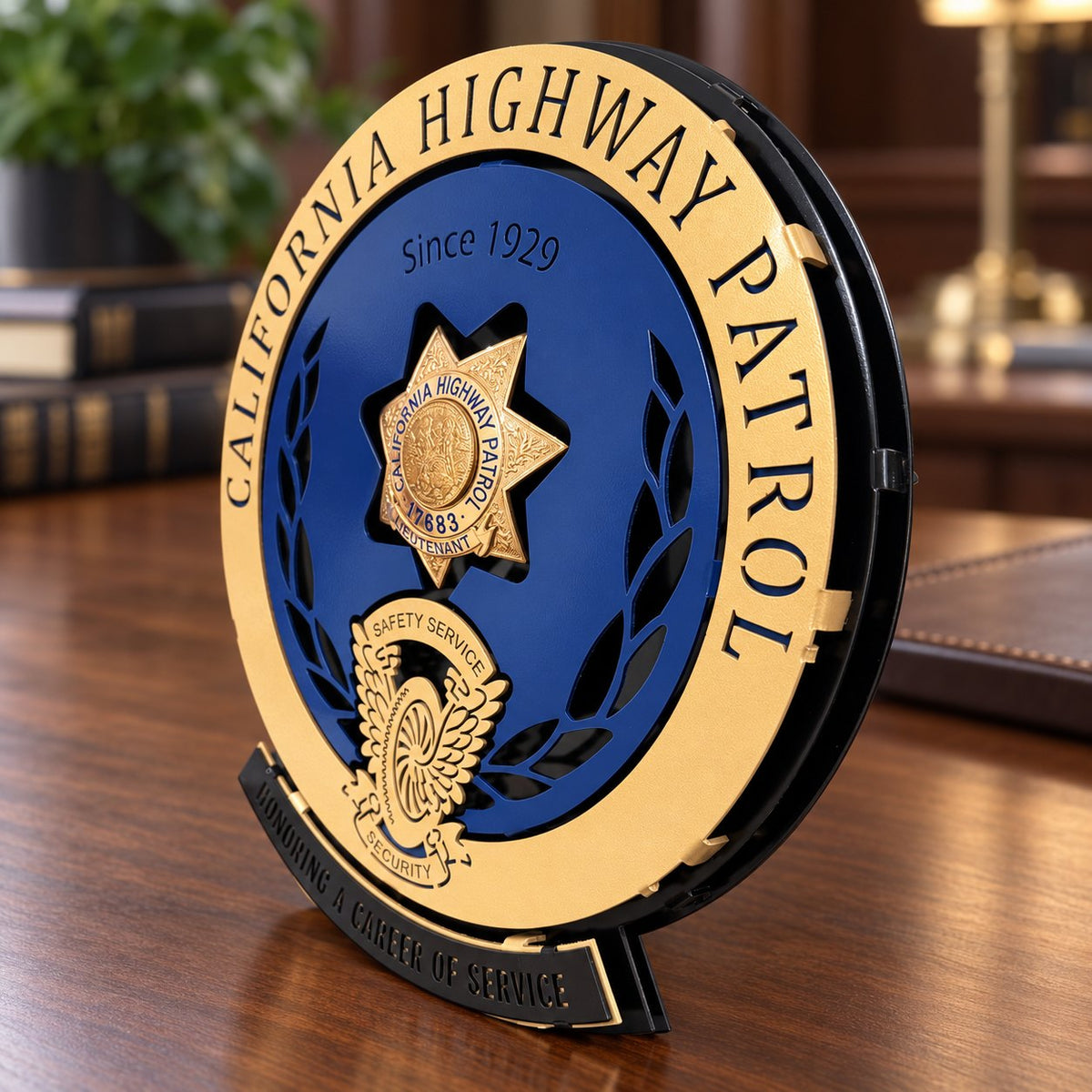 California Highway Patrol badge display in navy and gold, angled on a walnut desk to show layered aluminum construction, Badge Display CHP by IRONiNK.