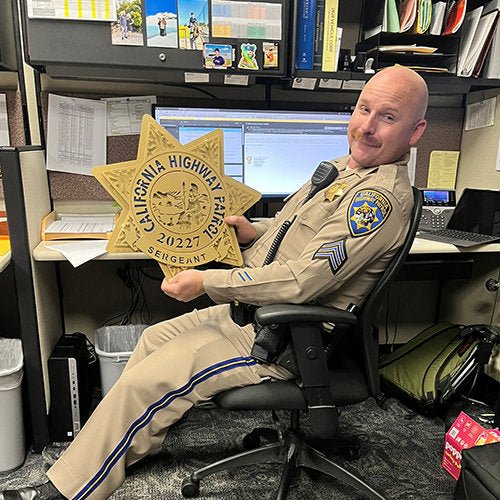 Uniformed officer holding a personalized CHP star, California Highway Patrol Star by IRONiNK.