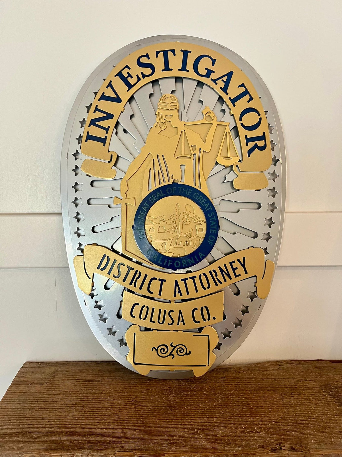 Close-up of gold and silver badge, Colusa County DA Investigations by IRONiNK.