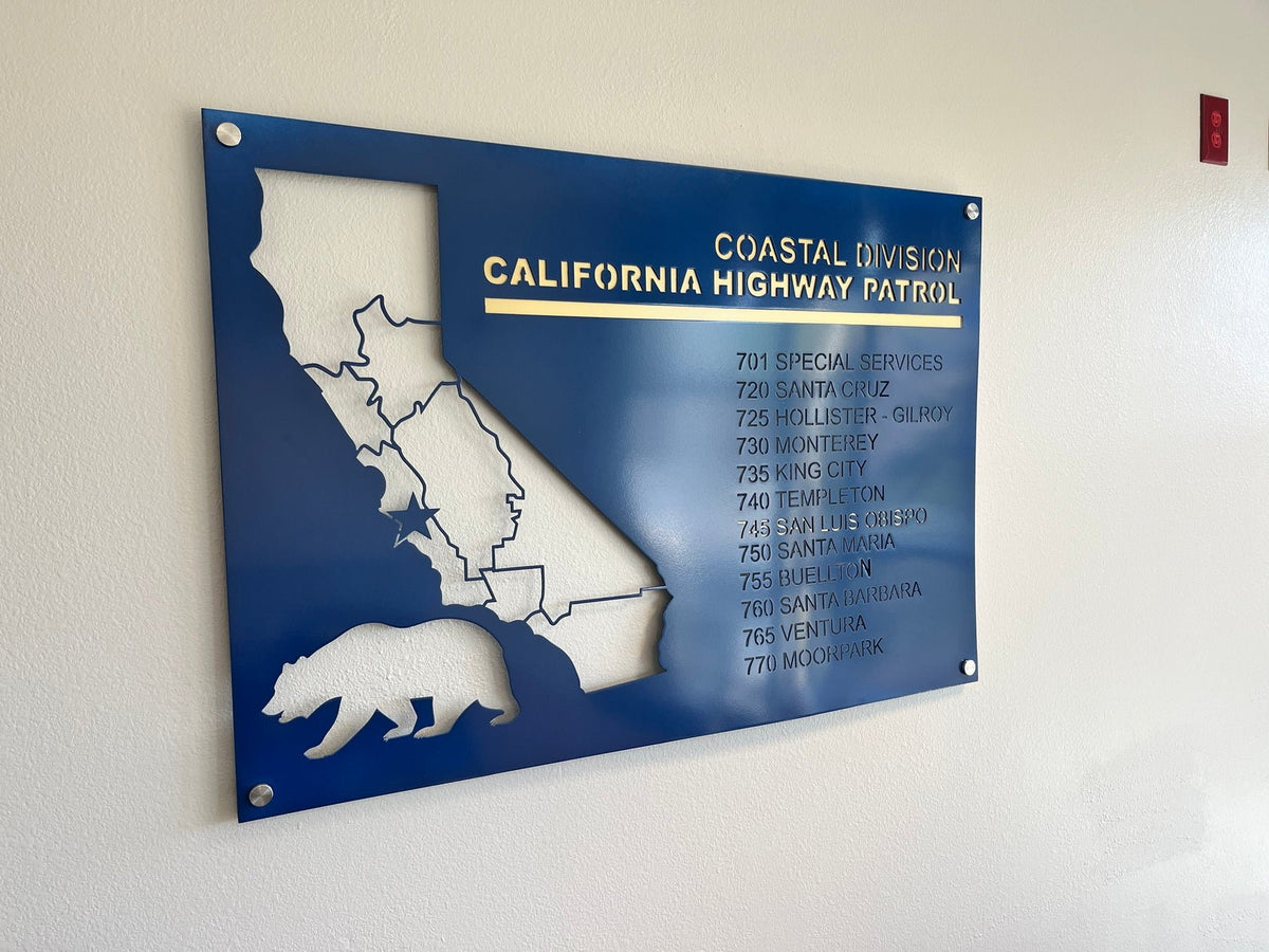Navy Coastal Division sign mounted on an interior wall.