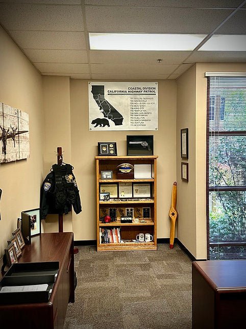 Wide view of Coastal Division sign installed in an office.