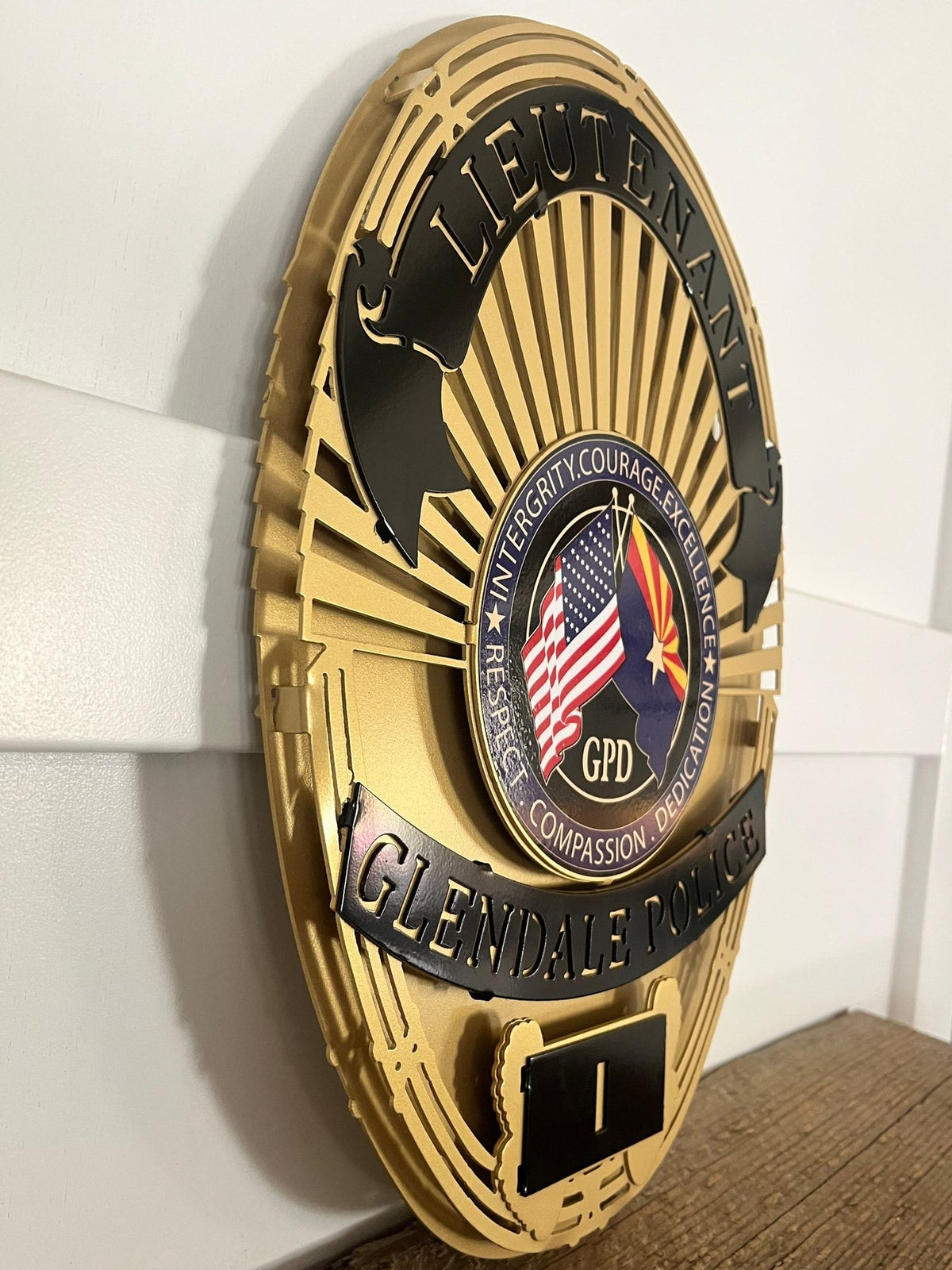 Gold lieutenant badge on a wooden shelf, Glendale Police Department (AZ) by IRONiNK.