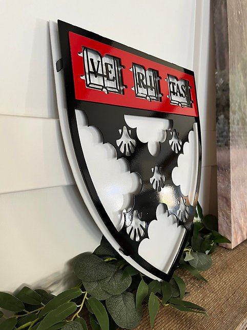 Angled view of raised shield layers, Harvard Business Solutions by IRONiNK.