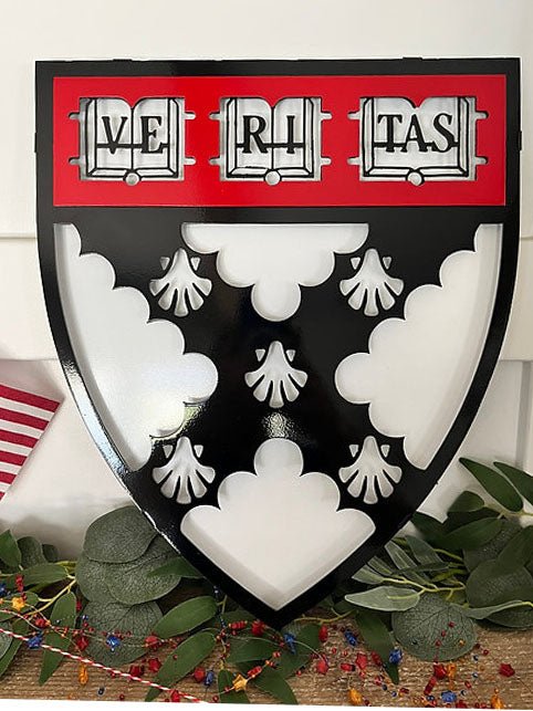 Black white and red Veritas shield on a wooden shelf, Harvard Business Solutions by IRONiNK.
