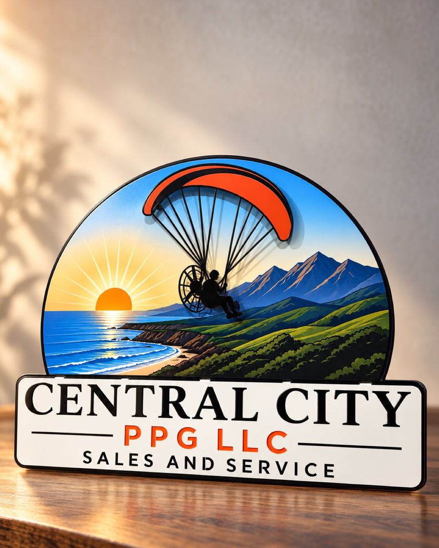 Central City PPG dimensional layered metal sign with a paraglider over a coastal sunrise scene