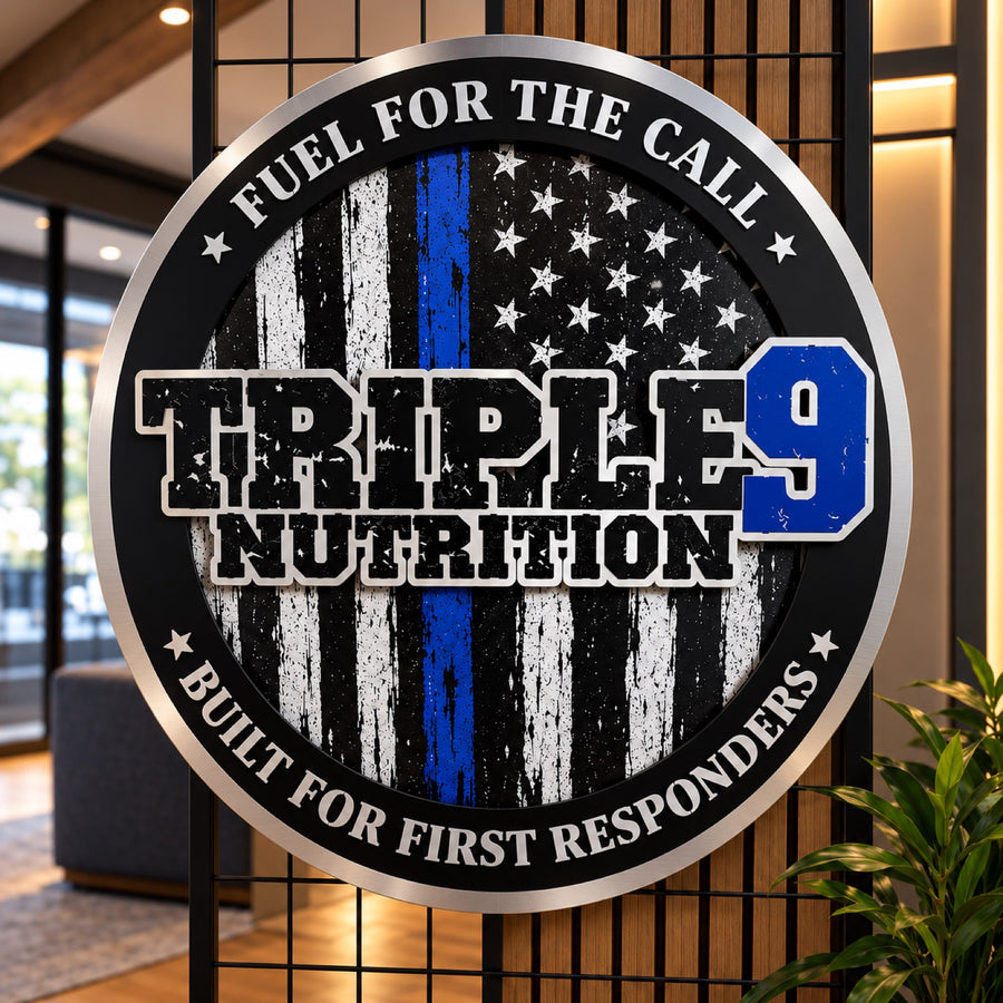Round dimensional metal sign for Triple 9 Nutrition with raised lettering over a distressed thin blue line flag design and a brushed silver rim