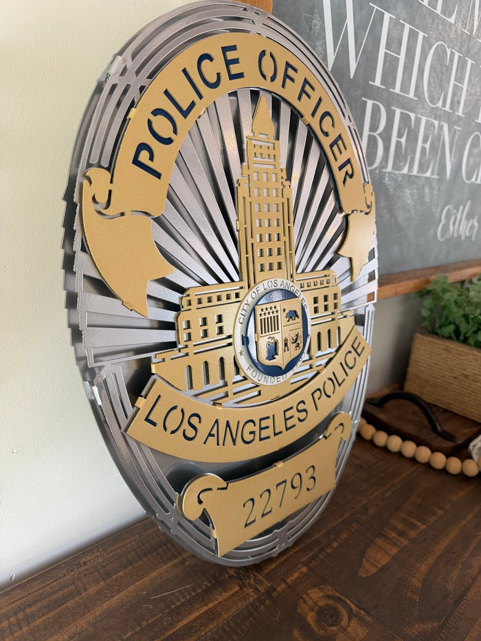 Angled view of gold and silver police badge, Los Angeles Police Department Badge by IRONiNK.