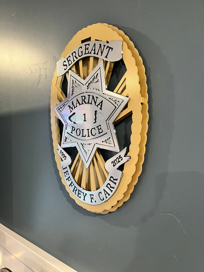 Angled view of wall-mounted badge, Marina Police Department by IRONiNK.