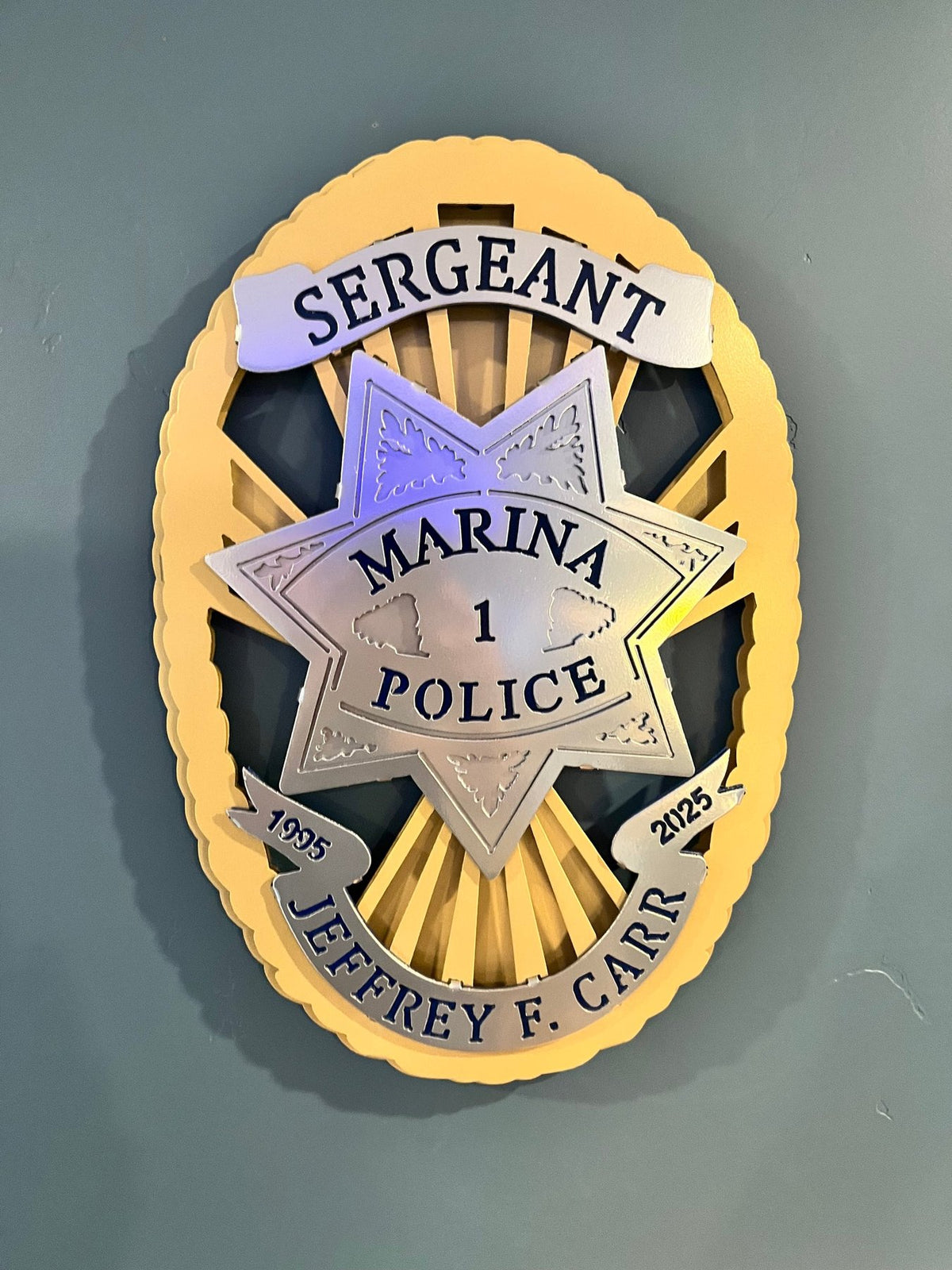 Badge mounted on an interior wall, Marina Police Department by IRONiNK.