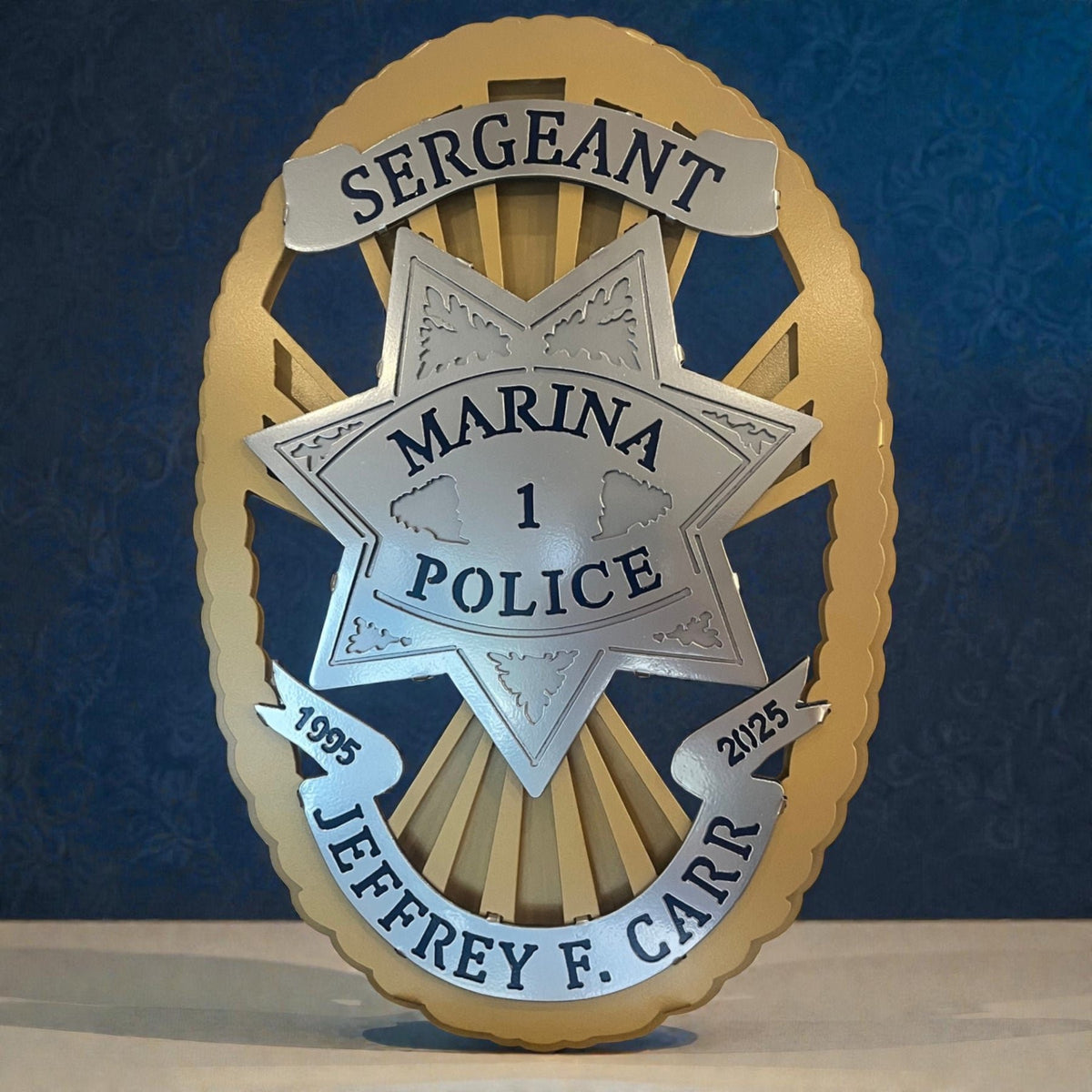 Front view of star and personalized name, Marina Police Department by IRONiNK.