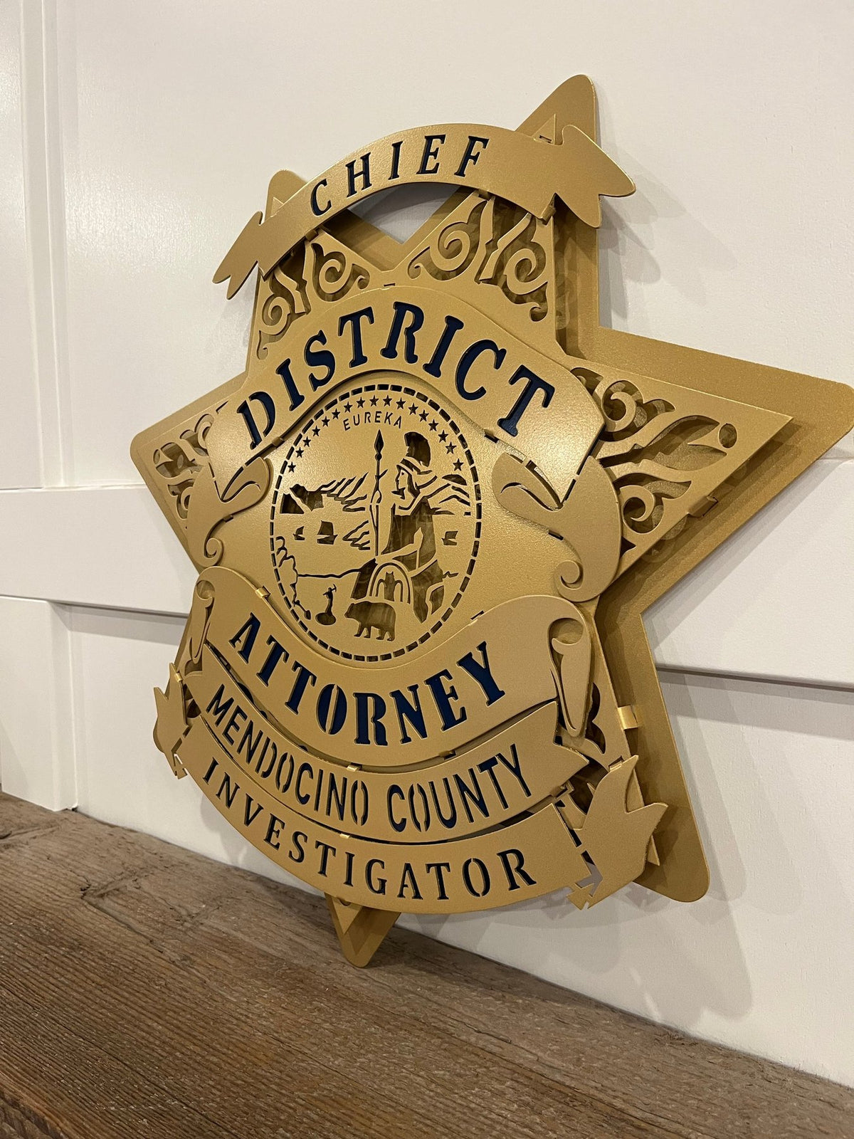Gold district attorney investigator star on a wall, Mendocino County DA Investigator Star by IRONiNK.