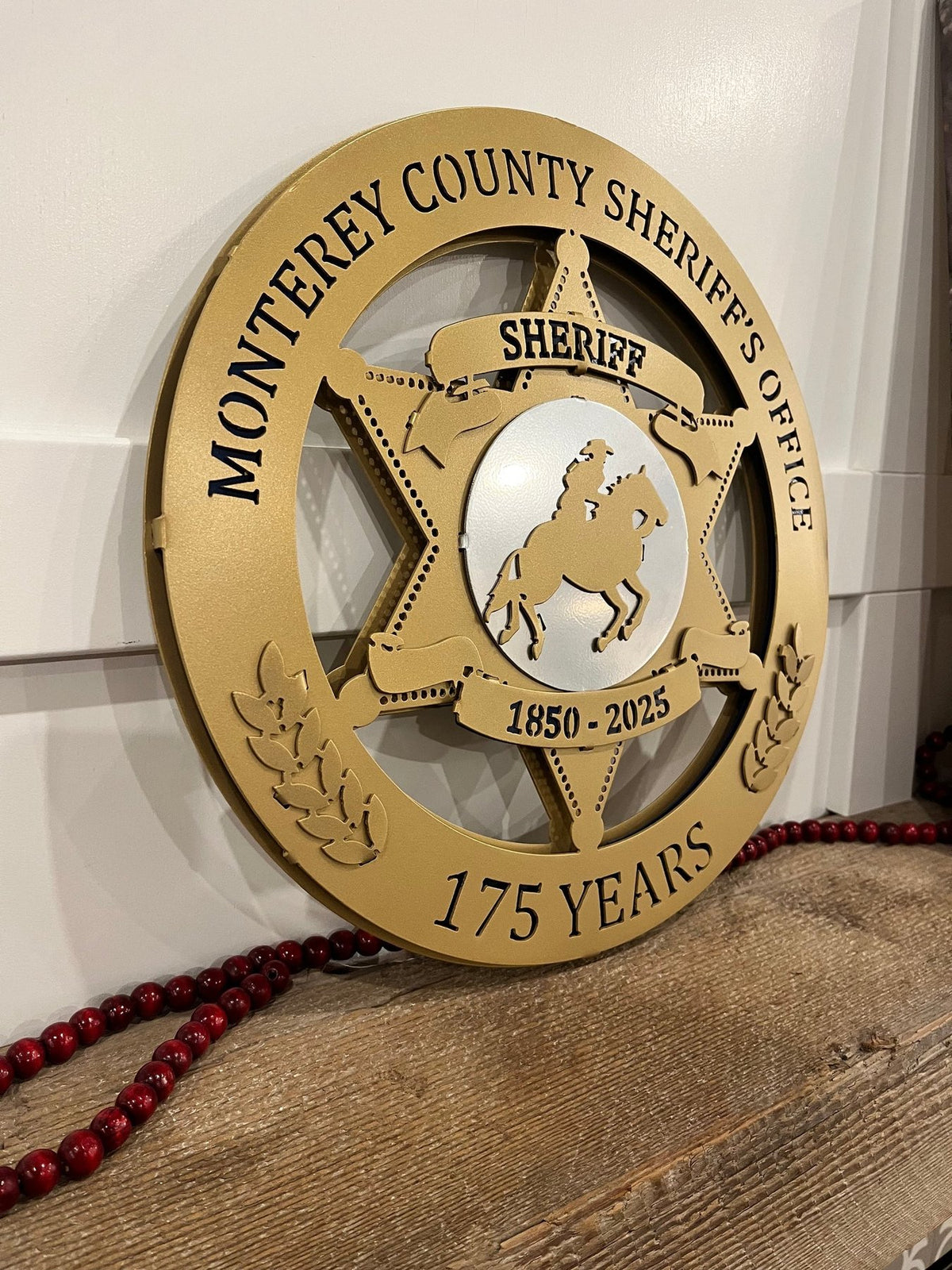 Angled view of raised anniversary sign layers, Monterey County Sheriff Star by IRONiNK.
