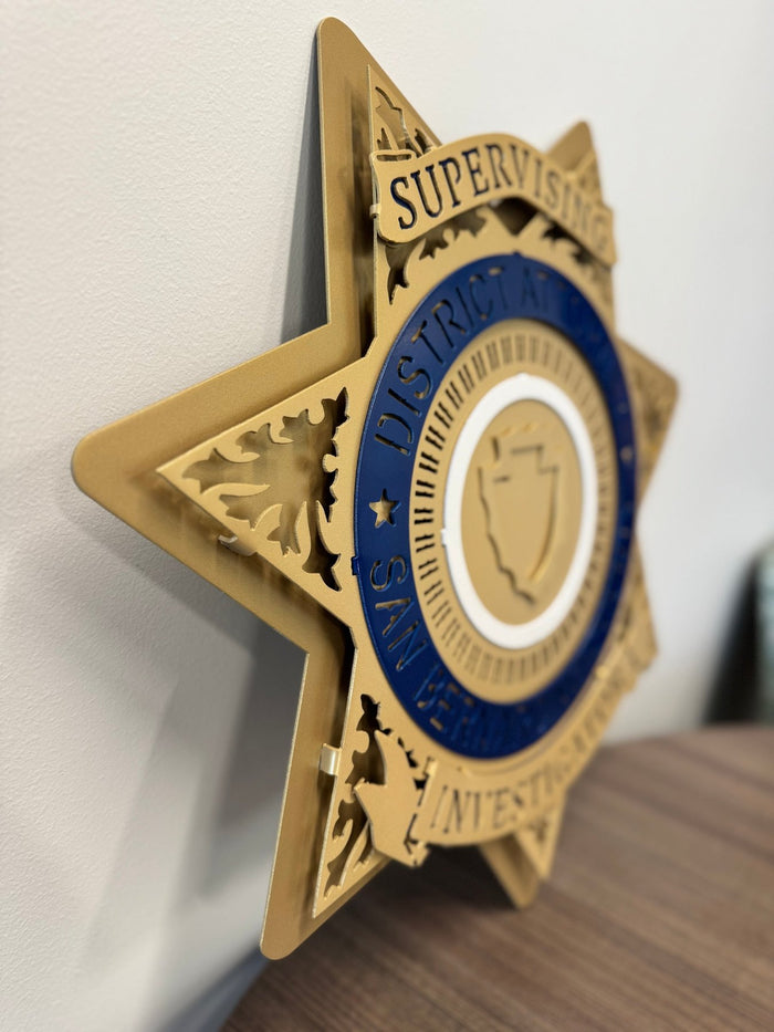 Angled view showing raised gold layers, San Bernardino County DA Star by IRONiNK.