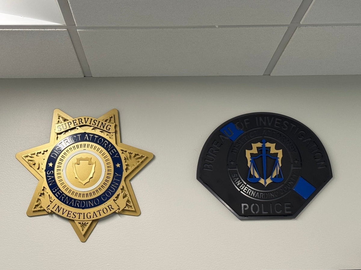 Investigator star and agency patch installed on an office wall, San Bernardino County DA Star by IRONiNK.