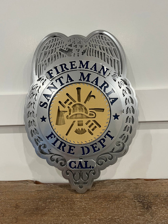 Close-up of silver badge and gold center, Santa Maria Fire Department (Retro Badge) by IRONiNK.