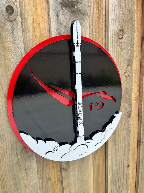 SpaceX Falcon 9: black and red rocket sign on a wooden wall.