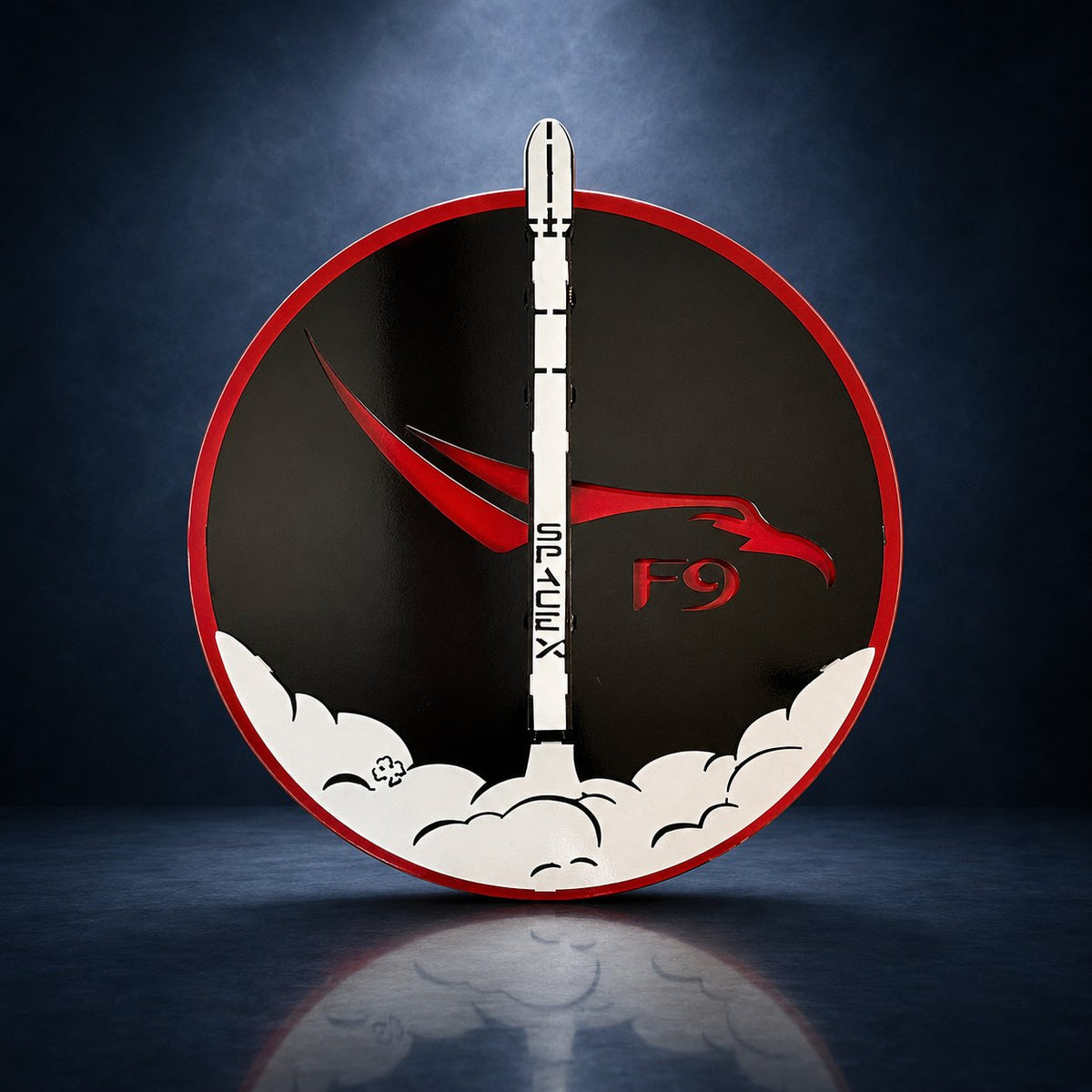 SpaceX Falcon 9: rocket sign against a dark blue studio background.